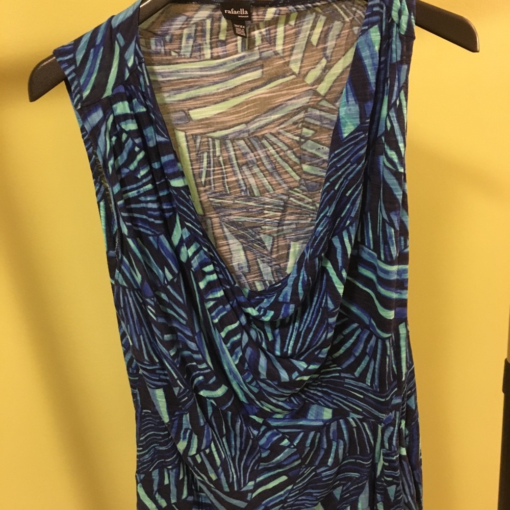 Blue sleeveless blouse.